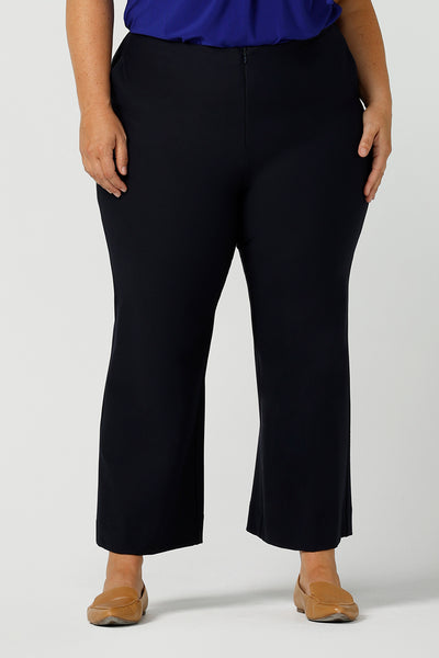 Great pants for curvy women, these flared leg, cropped pants are tailored for smart casual office wear.  Shown on a size 18 woman, these plus size navy blue pants are made in Australia by Australian and New Zealand women's clothing brand, Leina & Fleur. Shop quality pants in sizes 8 to 24 in their online fashion boutique!