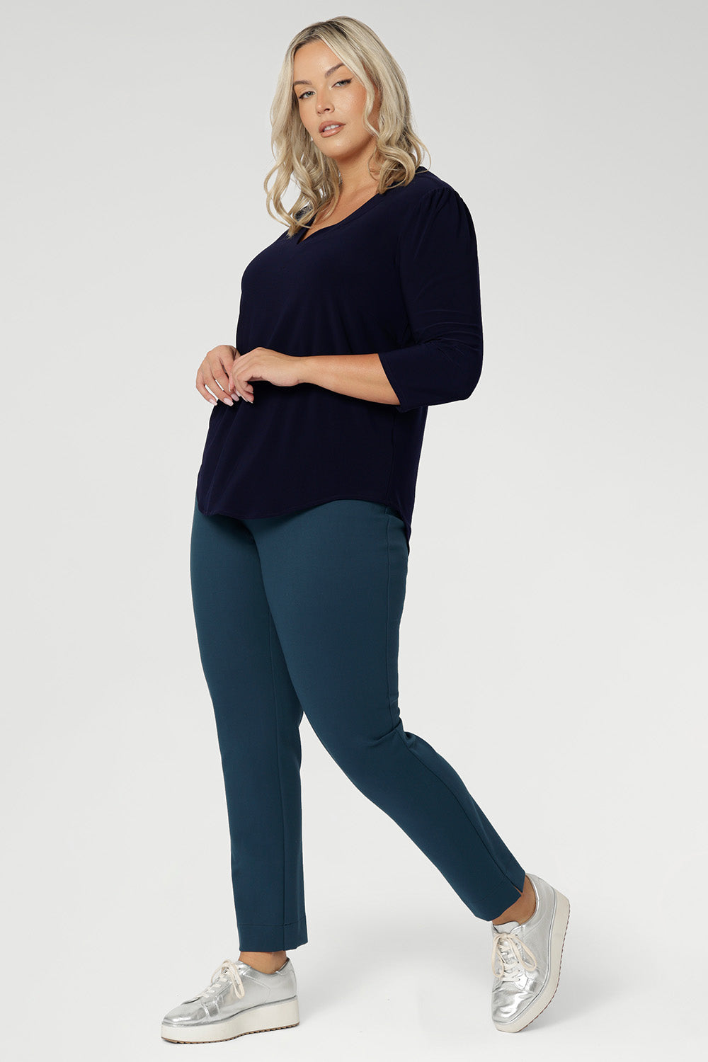 The Vida Top enhances curves with a smooth, tailored fit that feels as good as it looks. Seen from the back, the clean lines and elegant drape showcase its versatility and timeless appeal. Proudly made in Australia and available in inclusive sizes 8 to 24, the Vida Top is a must-have staple for every modern, confident woman.