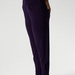 Close up image of Indi Pant in Amethyst in the long length, featuring the tapered leg
ankle cuffs and tailored tuck detail of the 7/8 length leg. Available in sizes 8-24 and 2 lengths to accommodate for all heights and styles.