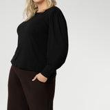 The ultimate knit top for effortless layering through the cooler months. Designed with a modern, feminine cut, it features a boat neckline and full-length bellow sleeves with soft gathers at the shoulders.
