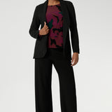 Zara is a modern-cut top with bellow sleeves and a subtle shape through the body—an effortless choice for transitioning from work to weekend. Pairs perfectly with our soft suiting collection. Size 10 model wears her printed workwear top with black easy care blazer and matching black pants.