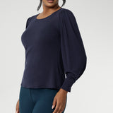 Zara is the ultimate knit top for effortless layering through the cooler months. Designed with a modern, feminine cut, it features a boat neckline and full-length bellow sleeves with soft gathers at the shoulders and tailored darts at the wrists—adding gentle volume without the bulk. Subtle shaping through the body and bust darts create a flattering, close-to-body fit that moves easily from work to weekend