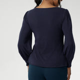 Feminine cut knit top features a boat neckline and full-length bellow sleeves with soft gathers at the shoulders and tailored darts at the wrists, adding gentle volume without the bulk. Subtle shaping through the body and bust darts create a flattering, close-to-body fit that moves easily from work to weekend. Available in sizes 8-24.