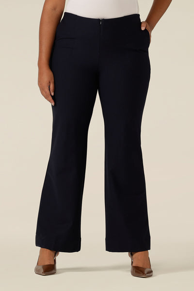 close up view of navy, flared leg pants in a size 12 by Australia and New Zealand women's clothing label, L&F. Mid-rise trousers in stretch ponte jersey fabric, these navy pants make comfortable workwear as well as casual pants.