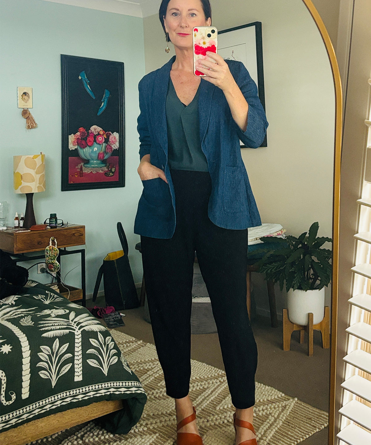 Founder of eco-conscious fashion label, Leina & Fleur wears cotton hemp sutainable blazer in vintage denim, pull-on shirt in green Tencel and tapered leg off duty pants