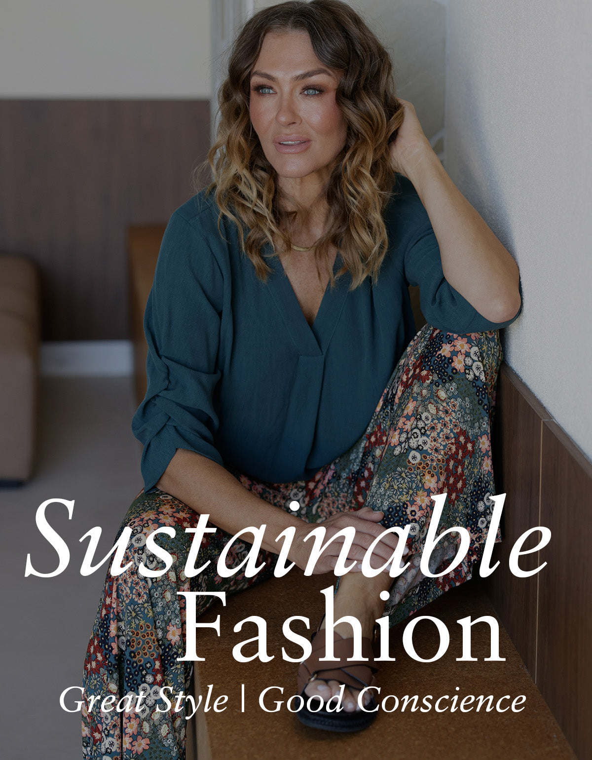 Showing sustainable fashion by Australian and New Zealand women's clothing brand, Leina & Fleur, a woman wears a sustainable, green Tencel shirt with sustainably made wide leg pants.