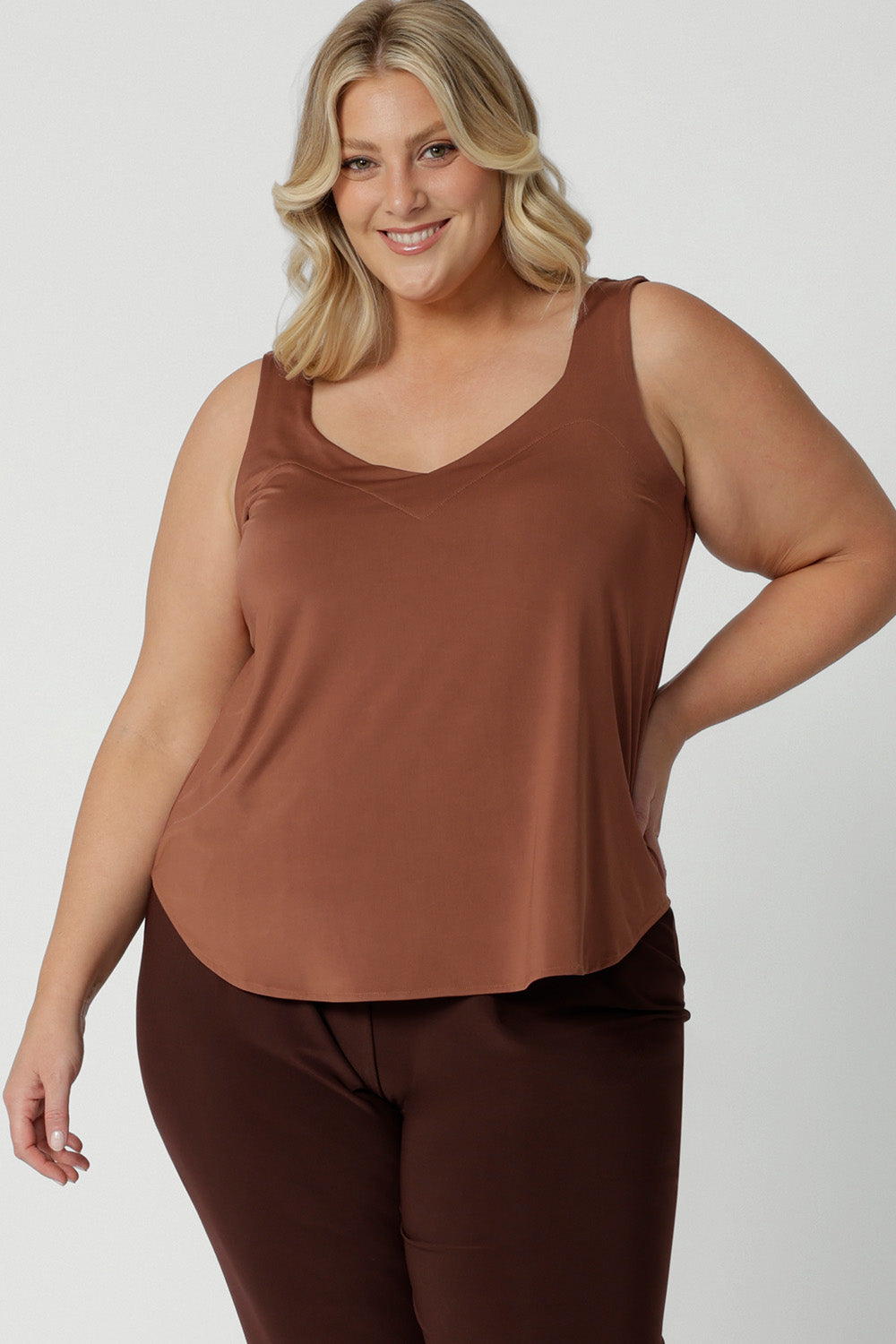 A great plus size cami top for casual weekend wear or event dressing. Eddy Cami in Clay has wide shoulder straps, a soft V-neckline and loose fitting slinky jersey body. Made in Australia by Australian fashion brand, Leina & Fleur.