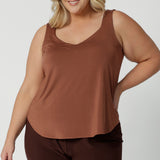 A great plus size cami top for casual weekend wear or event dressing. Eddy Cami in Clay has wide shoulder straps, a soft V-neckline and loose fitting slinky jersey body. Made in Australia by Australian fashion brand, Leina & Fleur.