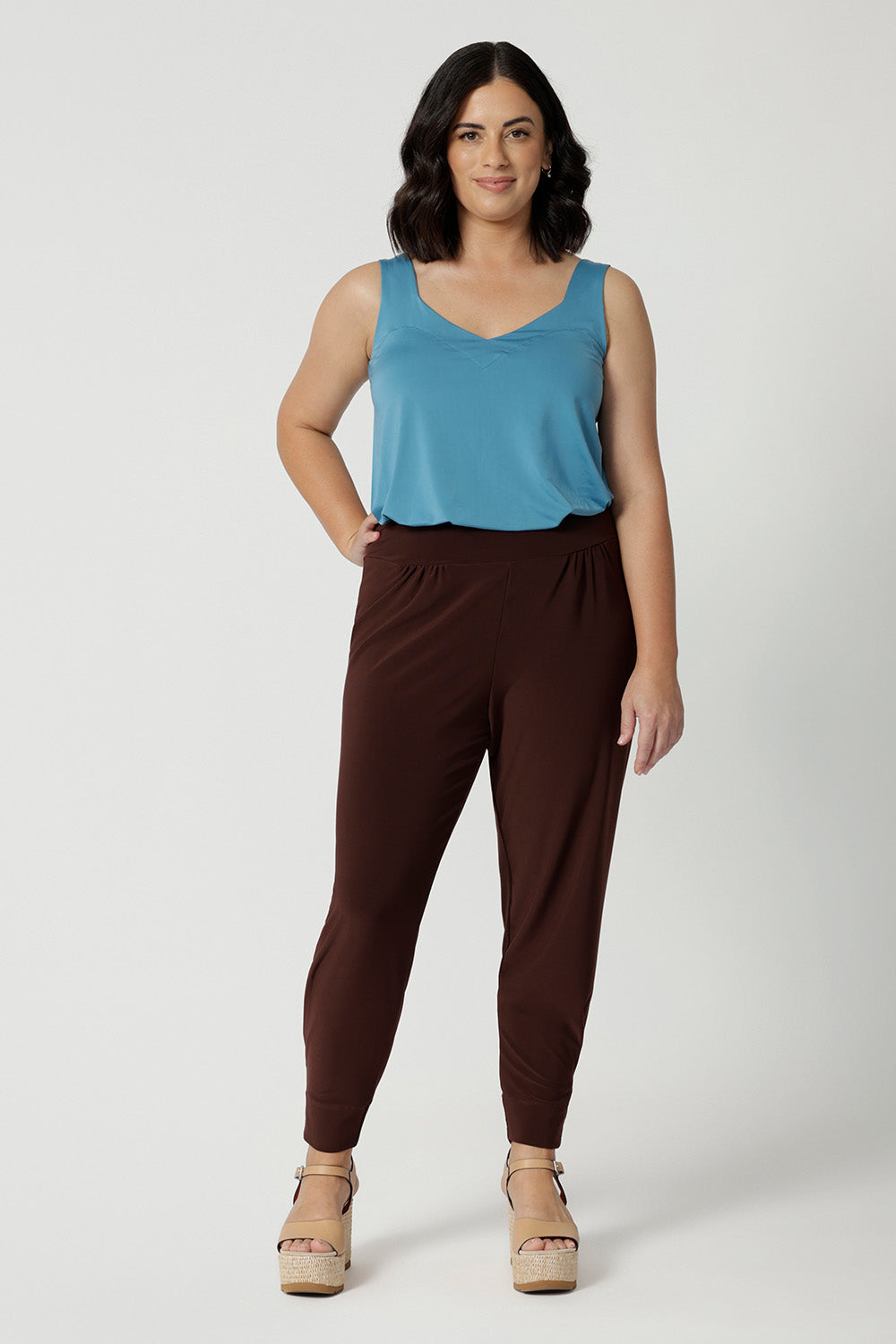 Good travel pants for petite women. These tapered leg pants by Australian and New Zealand women's  clothes brand, Leina & Fleur are comfortable stretchy pant in espresso brown jersey fabric. Shop pants for petite height women online in sizes 8 to 24.