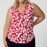 This sleeveless summer top combines  style and comfort with its vibrant red and ivory colour palette. Crafted from high-quality dry-touch jersey, it offers a cool yet breathable feel against the skin, perfect for warmer weather. Modern design makes it a versatile piece that can easily transition from casual outings to more polished looks paired back with our matching Caspian Palazzo Pant to create a faux jumpsuit look.