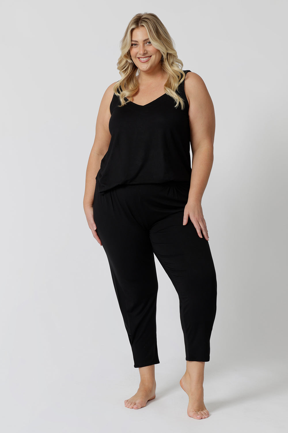 A good loungewear pant for curvy women, this black tapered plus size leg pant is a pull-on pyjama pant. Worn with black bamboo cami top, this is a breathable, thermo-regulating pyjama set and makes get sleepwear for night sweats and hot flushes. Shop loungewear sets online at L&F Australia.