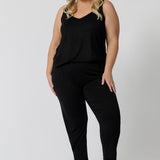 A good loungewear pant for curvy women, this black tapered plus size leg pant is a pull-on pyjama pant. Worn with black bamboo cami top, this is a breathable, thermo-regulating pyjama set and makes get sleepwear for night sweats and hot flushes. Shop loungewear sets online at L&F Australia.