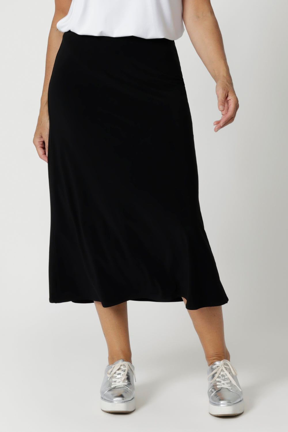 The skirt features a pull-on style with internal elastic at the waist, providing a secure yet comfortable fit that stretches with your body for maximum comfort. The bias-cut design creates natural shaping, gently skimming your curves for a flattering, feminine silhouette without being restrictive. Sizes 8-24 available. 