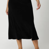 The skirt features a pull-on style with internal elastic at the waist, providing a secure yet comfortable fit that stretches with your body for maximum comfort. The bias-cut design creates natural shaping, gently skimming your curves for a flattering, feminine silhouette without being restrictive. Sizes 8-24 available. 