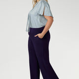 Made in Australia, these pull-on pants are available in three lengths, providing the perfect fit for various body types. The deep, double-layer waistband offers a smooth and flattering silhouette, while the side pockets with topstitching detail provide both functionality and a stylish touch. Stretchy workwear pants are available in sizes 8-24.