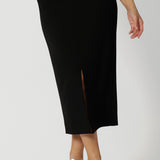 Close up of a good black skirt for over 40s women's style, this straight-cut midi skirt in lightweight scuba crepe jersey is , made in Australia by Australian and New Zealand women's clothing brand, Leina & Fleur, this stretchy, easy-care skirt is a perfect workwear suit or off-duty styling.