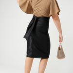 A shimmering jersey neck tie in black puts the finishing touch to an event outfit with a difference. Worn with a honey glam top and matching Xanadu skirt, the necktie is used as a belt. Made in Australia by women's clothing and occasionwear brand, L&F.
