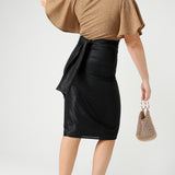 A shimmering jersey neck tie in black puts the finishing touch to an event outfit with a difference. Worn with a honey glam top and matching Xanadu skirt, the necktie is used as a belt. Made in Australia by women's clothing and occasionwear brand, L&F.
