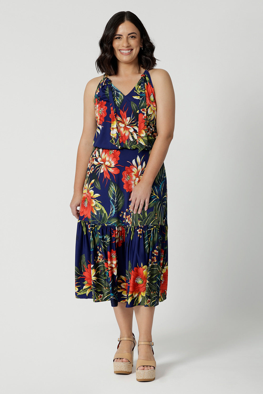 A good maxi dress for summer worn on petite woman. This printed jersey dress has halter neck and flutter hem. A dress for cruise holidays and resort style. This midi dress is easy-care and crease-resistant. Made in Australian for Australian and New Zealand women. Clothes brand Leina & Fleur have sizes in sizes 8 to 24. Shop their cruise wear fashions online now.