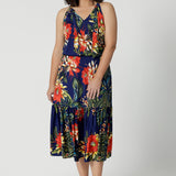 A good maxi dress for summer worn on petite woman. This printed jersey dress has halter neck and flutter hem. A dress for cruise holidays and resort style. This midi dress is easy-care and crease-resistant. Made in Australian for Australian and New Zealand women. Clothes brand Leina & Fleur have sizes in sizes 8 to 24. Shop their cruise wear fashions online now.