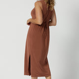 Back view of a dress for over 40s women, this sleeveless clay coloured dress in slinky jersey fabric is perfect as an off duty summer dress. Made in Australia by Australian and New Zealand women's clothes label Leina & Fleur. This midi-length empire line dress is available in sizes 8 to 24.