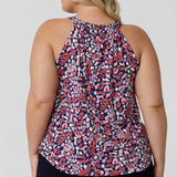 Back view of  a summer top for over plus size women. This halter neck top is a comfortable, easy-care top worn with white pants for summer.  In red, pink, white and navy print, this plus size jersey top is a made in Australia top by Australian and New Zealand women's clothes brand, Leina & Fleur, shop their petite to plus size tops online. 