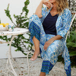 Lounge and Sleepwear robes for over 40s women don't get much better than this! A size 12 woman wears a relaxed fit lounge robe in blue and white print with bottoms for matching pyjama set and jersey cami . This modal robe is breathable and therm-regulating, making it a robe to keep you cool when getting ready and also a good sleepwear robe for night sweats and hot flushes. Shop robes online as part of women's fashion brand, L&F's new lounge and sleepwear wear range for women. 