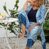 Lounge and Sleepwear robes for over 40s women don't get much better than this! A size 12 woman wears a relaxed fit lounge robe in blue and white print with bottoms for matching pyjama set and jersey cami . This modal robe is breathable and therm-regulating, making it a robe to keep you cool when getting ready and also a good sleepwear robe for night sweats and hot flushes. Shop robes online as part of women's fashion brand, L&F's new lounge and sleepwear wear range for women. 