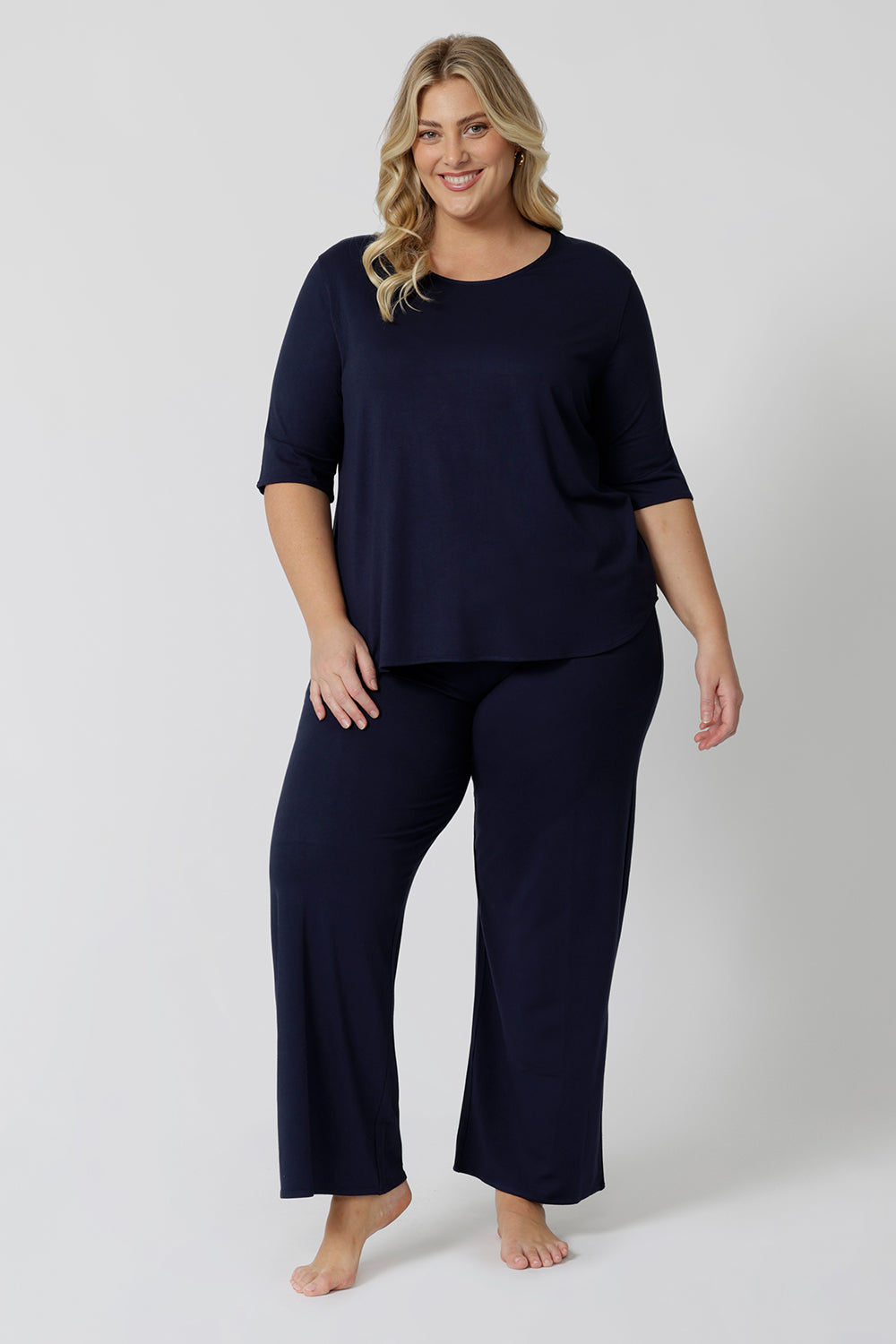 This navy blue tee top with 3/4 sleeves looks great as plus size sleepwear. Worn with navy blue lounge pants as a pyjama set, this curve top makes for a comfortable pyjama top and being breathable and thermo-regulating, it's a great top for night sweats and hot flushes.