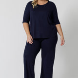 This navy blue tee top with 3/4 sleeves looks great as plus size sleepwear. Worn with navy blue lounge pants as a pyjama set, this curve top makes for a comfortable pyjama top and being breathable and thermo-regulating, it's a great top for night sweats and hot flushes.