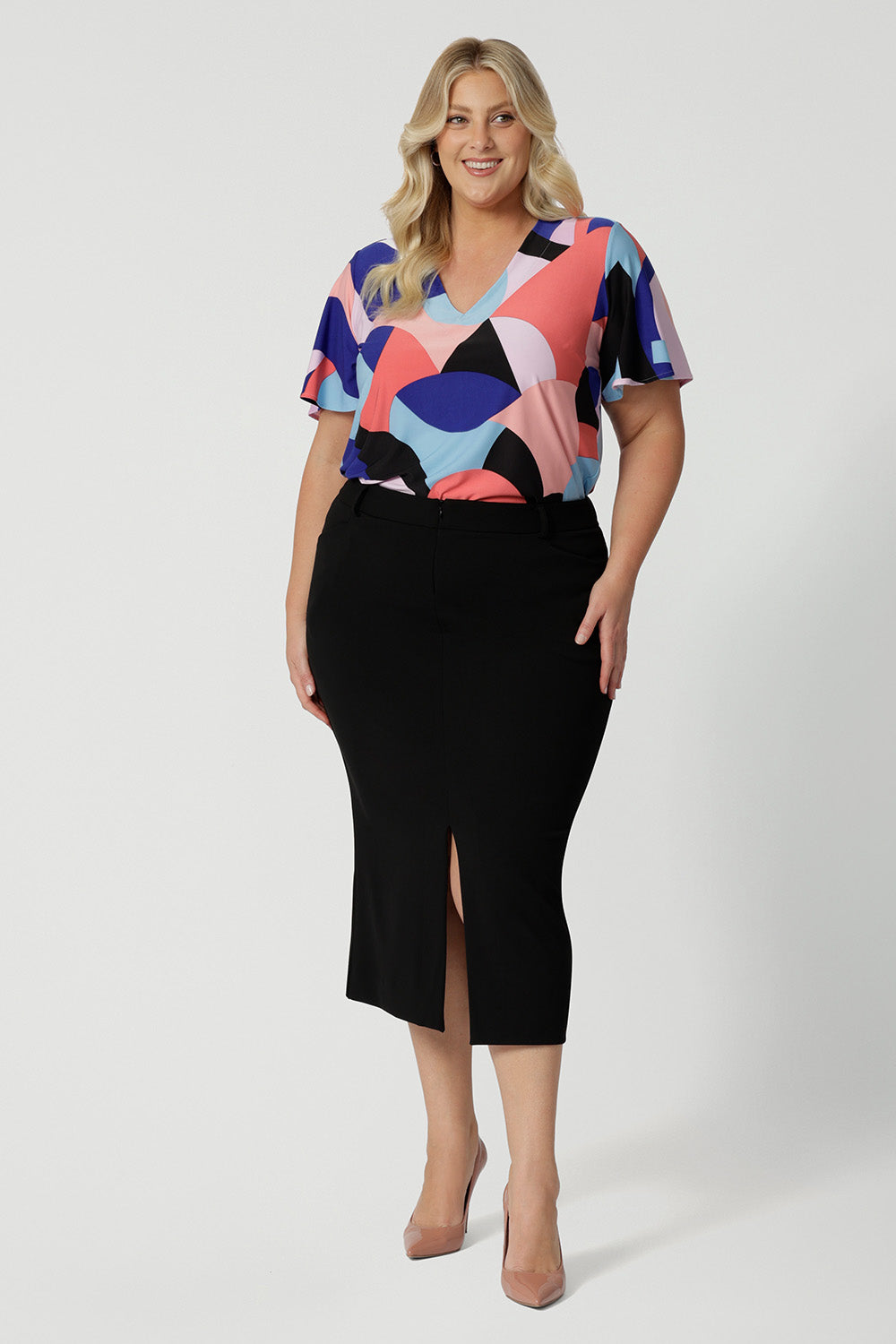 Leina & Fleur's plus size straight-cut black midi skirt, is crafted in lightweight scuba crepe jersey for curvy women. Made in Australia by the Australian and New Zealand women's clothing brand, this easy-care, stretchy skirt delivers comfort and style for plus size women - available in skirt sizes 8 to 24.