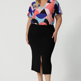 Leina & Fleur's plus size straight-cut black midi skirt, is crafted in lightweight scuba crepe jersey for curvy women. Made in Australia by the Australian and New Zealand women's clothing brand, this easy-care, stretchy skirt delivers comfort and style for plus size women - available in skirt sizes 8 to 24.