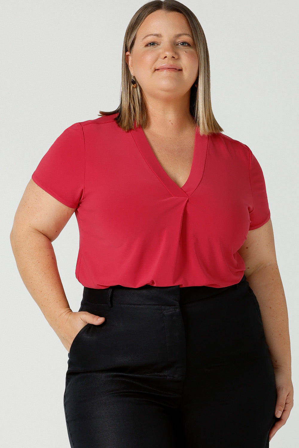 Close up of curvy size 18 woman wears Raspberry Emily top with V-Neck and short sleeves in soft jersey. Styled back with navy Ronnie pant in Midnight linen. Made in Australia for women size 8 - 24.