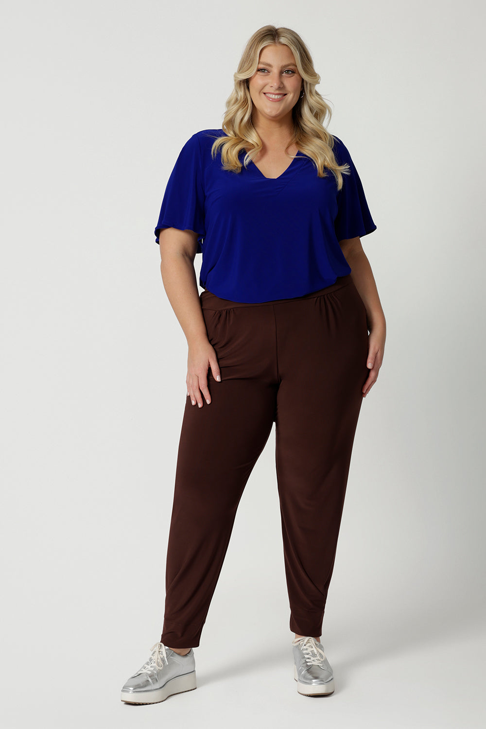 Off duty pants for tall, plus size women, these tapered leg, long length pants by Australian and New Zealand women's  clothing brand, Leina & Fleur are comfortable stretchy pants in espresso brown jersey fabric. Shop travel pants for plus size women and ladies tall pants online in sizes 8 to 24.