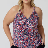 A good summer top for plus size women, this halter neck top is a comfortable, easy-care top.  Shown ona. size 18  woman as a plus size and curve top, in red, pink, white and navy print, this slinky jersey top is a made in Australia top by Australian and New Zealand women's clothes brand, Leina & Fleur, shop their petite to plus size tops online. 