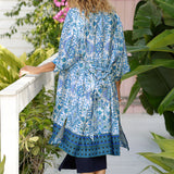 Lounge and Sleepwear robes for over 40s women don't get much better than this! Back view of a womens dressing gown size 12. This is a relaxed fit lounge robe in blue and white print. This modal robe is breathable and therm-regulating, making it a robe to keep you cool when getting ready and also a good sleepwear robe for night sweats and hot flushes. Shop robes online as part of women's fashion brand, L&F's new lounge and sleepwear wear range for women. 