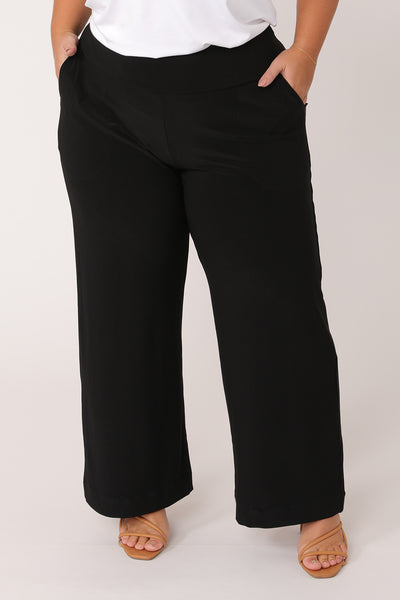 Straight, wide-leg black pants cut in petite length. These petite work pants are comfortable in pull-on jersey fabric and made in Australia in sizes 8 to 24
