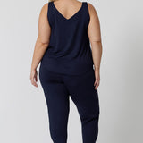 Back view of a good loungewear pant for curvy women. This navy bamboo tapered leg,  plus size pant is a pull-on pyjama pant. Worn with navy bamboo cami top, this is a breathable, thermo-regulating pyjama set and makes get sleepwear for night sweats and hot flushes. Shop loungewear sets online at L&F Australia.