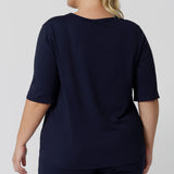 Back view of a 3/4 sleeve, navy blue tee top. A great top for plus size sleepwear, it's worn by a size 18 woman, this curve top makes for a comfortable pyjama top and being breathable and thermo-regulating, it's a great top for night sweats and hot flushes.