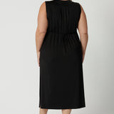 Back view of a women's plus size black jersey dress  Shown on a size 18, this sleeveless black dress is made in Australia by Australian and New Zealand women's fashion brand, L&F. Shop plus size summer dresses Australia online in size 8 to 24.