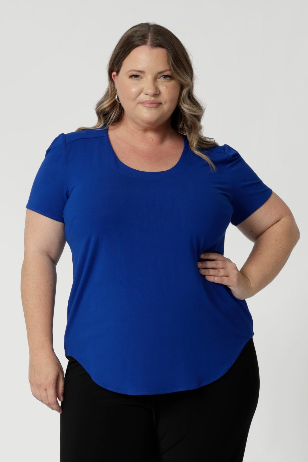 Available in sizes 8-24, this top is designed to flatter a variety of body types, providing a sleek silhouette while ensuring comfort. It comes in five different colorways, giving you the option to choose your perfect hue. 