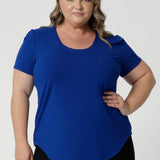 Available in sizes 8-24, this top is designed to flatter a variety of body types, providing a sleek silhouette while ensuring comfort. It comes in five different colorways, giving you the option to choose your perfect hue. 