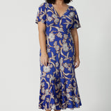 A good empire line dress for petite height women, this twist front jersey dress in size 10 has flutter sleeves and a ruffle hem. A blue dress with floral print, be holiday ready with this travel and cruise wear dress style. Made in Australia by Australian and New Zealand womens clothing brand, Leina & Fleur, shop their petite to plus sizes dresses online.