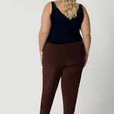 Back view of Australian-made travel pants for curvy, plus size women. These tapered leg pants by Australian and New Zealand women's  clothing brand, Leina & Fleur are comfortable stretchy pants in espresso brown jersey fabric. Shop travel pants for plus size women online in sizes 8 to 24.