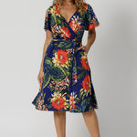 The Maggie Knee Length Dress in Bahagia is perfect for cruise holidays and resort style. This wrap dress style is crafted with quality and local craftsmanship. This floral jersey fabric is easy-care and crease-resistant. Leina & Fleur stock sizes in sizes 8 to 24. Shop wrap dresses online.