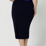 Navy workwear skirt is made of easy to care fabric in scuba crepe fabric. Workwear skirt has a deep navy colour. This comfortable work wear skirt provides full body stretch great for any office or corporate setting. Australia made clothing. Made by Australian and New Zealand women. Leina and Fleur is a woman’s fashion label that stocks sizes from 8 to 24. Shop this appropriate work skirt in plus size and petite sizes. 