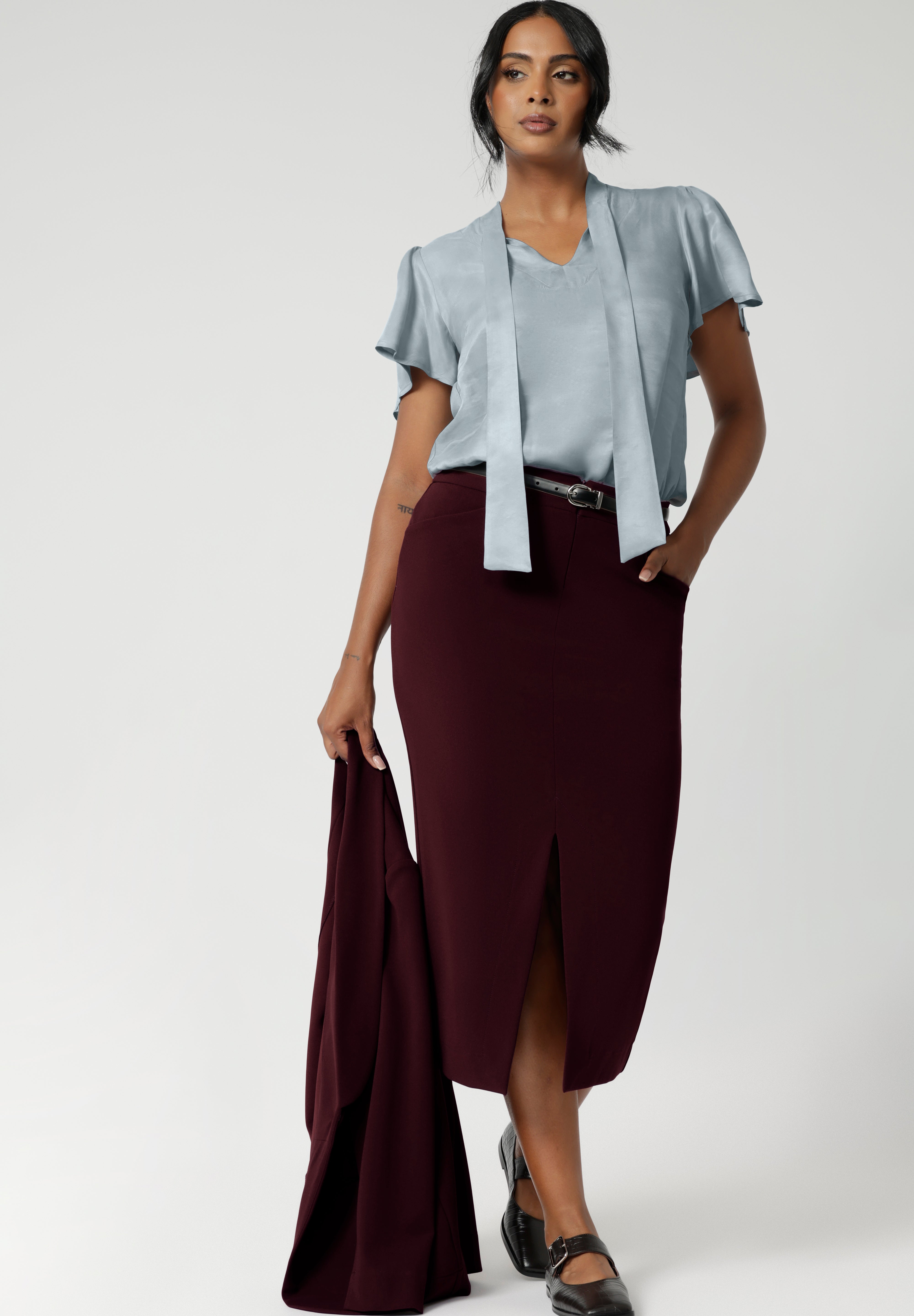 This women's workwear midi skirt in a stunning wine colour is made from a luxe, easy-care Scuba Crepe Jersey fabric, offering a soft textured feel and full body stretch for comfort and flexibility throughout your day.