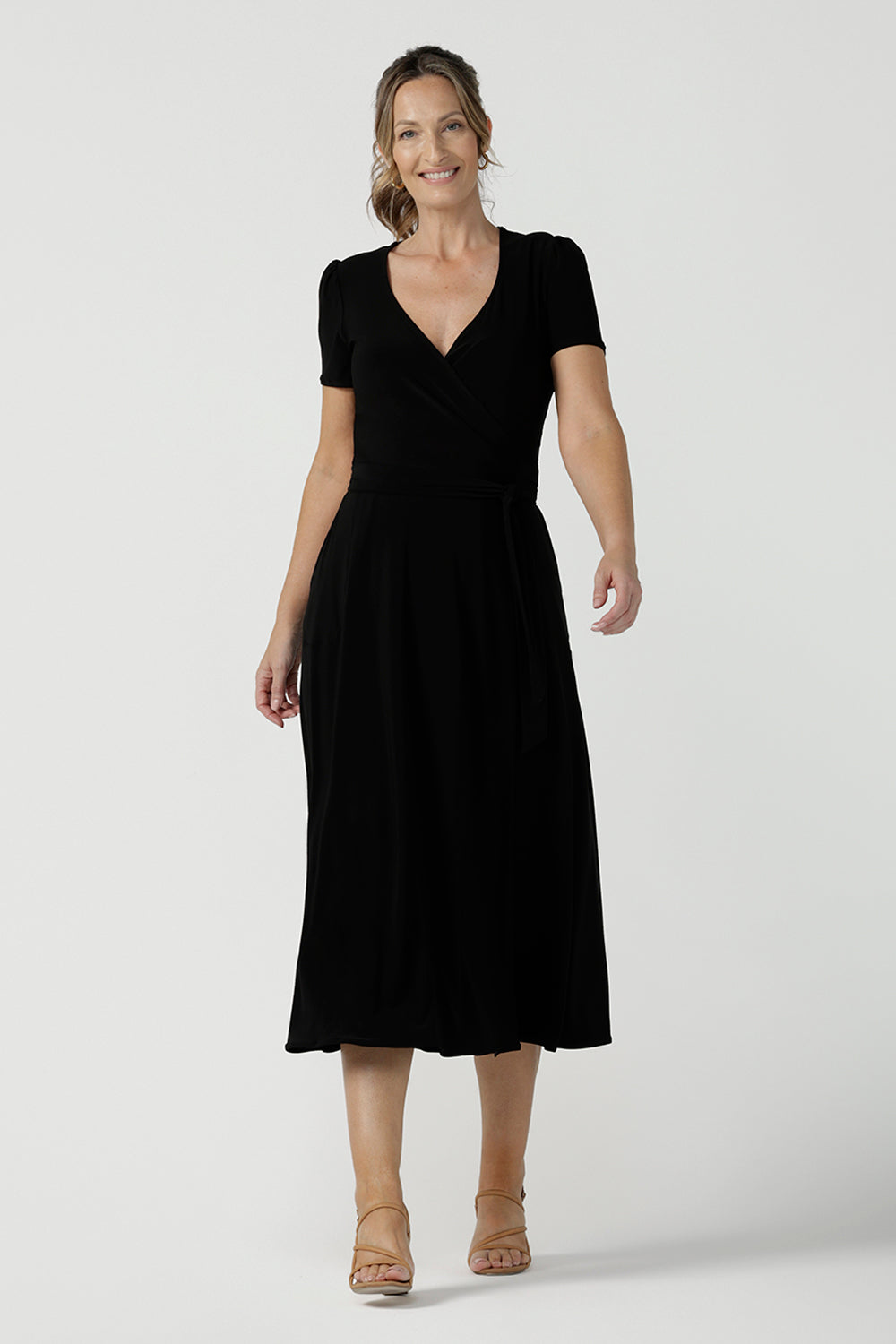 Size inclusive jersey wrap dress in size 8. Curvy women workwear midi dress with pockets. Black dress. 