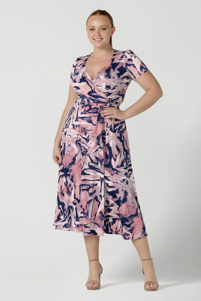 Size 12 woman wears the Alexis dress a functioning wrap dress with short sleeve and midi length. Great for work to weekend wear. Made in Australia for women size 8 - 24.