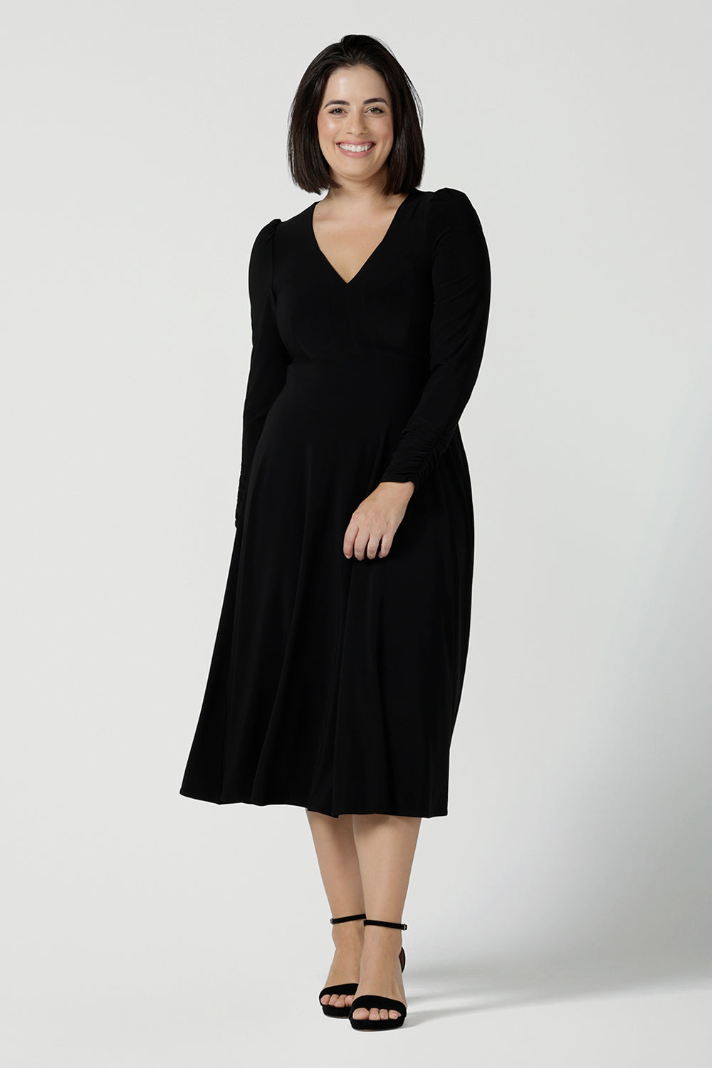 Size 10 Alyssa Dress in jersey. V-neckline style great for work to weekend wear. Corporate dress for women. Travel friendly with an empire line style. Midi dress and styled back with black strappy heels. Made in Australia for women size 8 - 24.